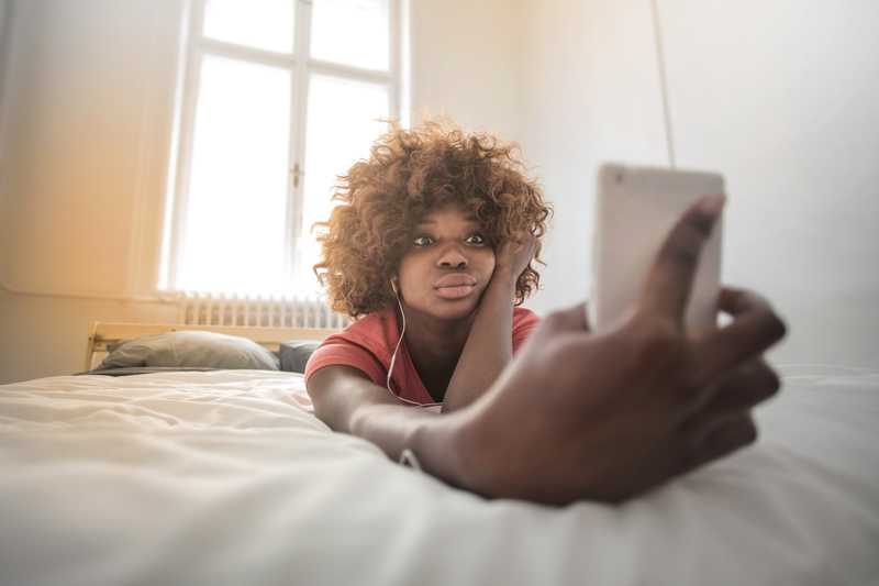 Black woman with phone