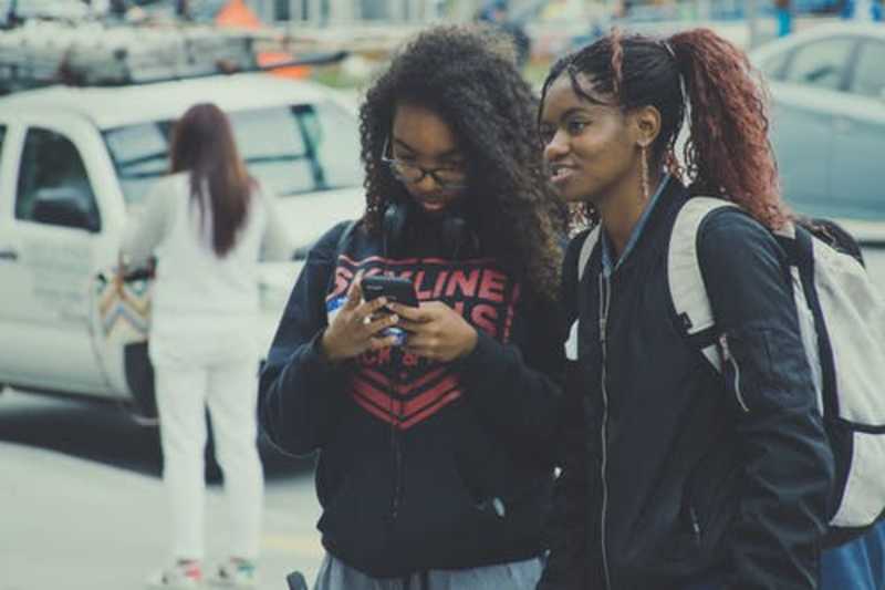 Girls checking news