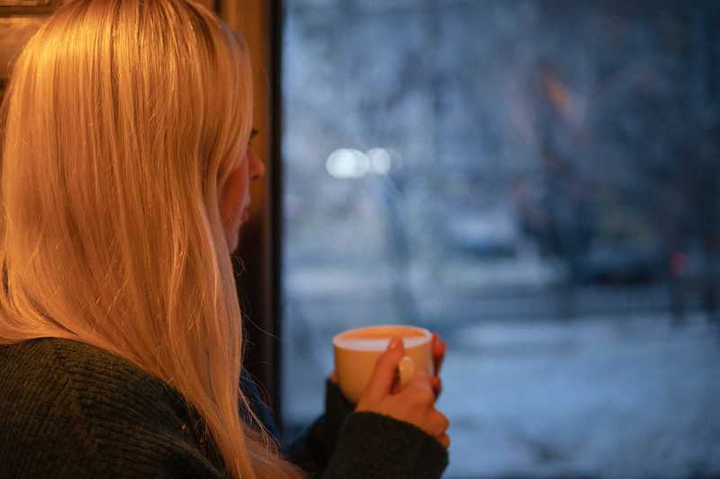 Woman looking out window